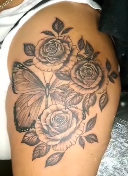Rose thigh tattoo by Skin Deep Tattoos